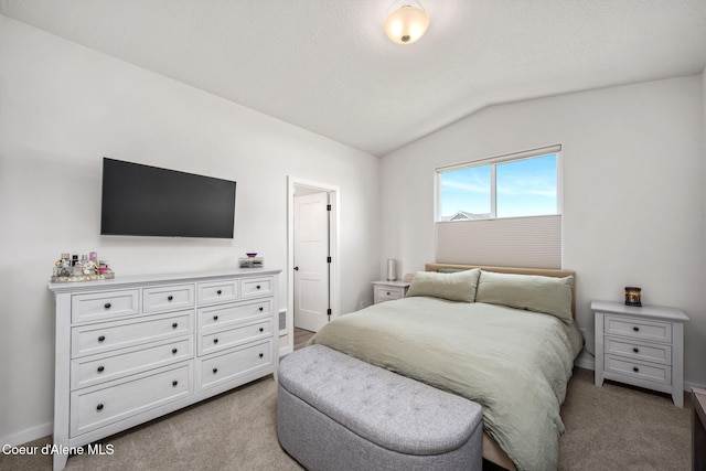 7991 N Girard Cir, Coeur Dalene, ID 83815 - carpeted bedroom featuring vaulted ceiling and baseboards