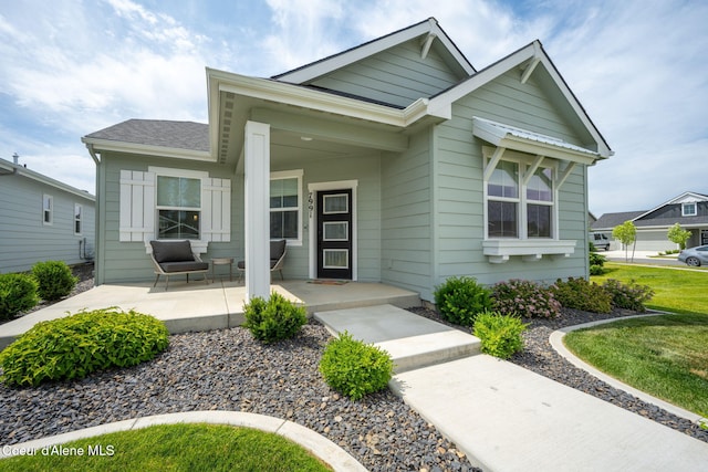 7991 N Girard Cir, Coeur Dalene, ID 83815 - view of front of home with a porch