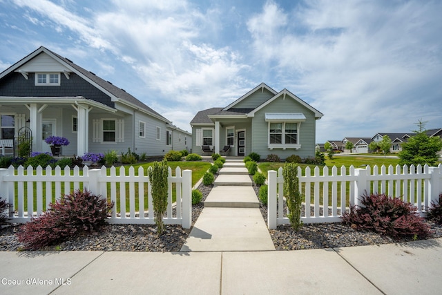 7991 N Girard Cir, Coeur Dalene, ID 83815 - view of front facade featuring a fenced front yard and a porch