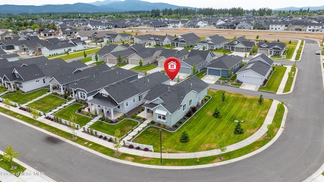 7991 N Girard Cir, Coeur Dalene, ID 83815 - aerial perspective of suburban area featuring a mountainous background
