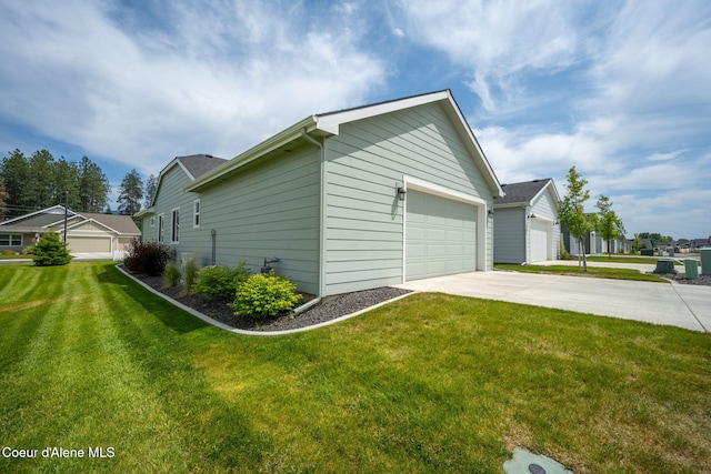 7991 N Girard Cir, Coeur Dalene, ID 83815 - view of property exterior with a lawn, concrete driveway, and a garage