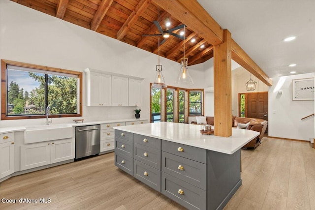 400 S Ohana Beach Dr, Coeur Dalene, ID 83814 - kitchen with stainless steel dishwasher, gray cabinets, light countertops, white cabinetry, and light wood-style floors