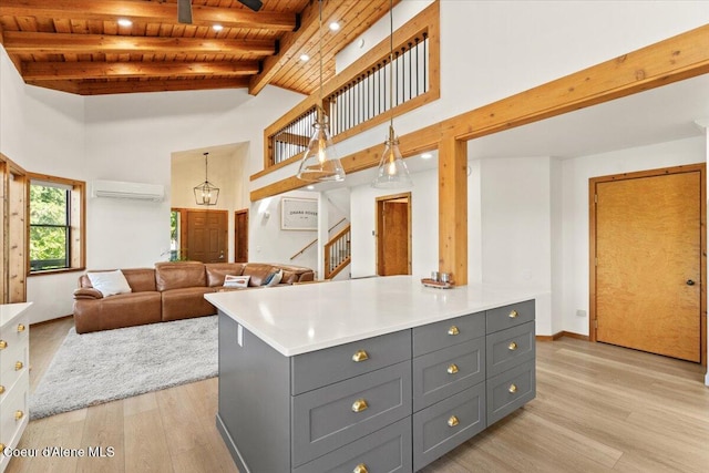 400 S Ohana Beach Dr, Coeur Dalene, ID 83814 - kitchen featuring gray cabinets, a wood ceiling with exposed beams, light wood-type flooring, a wall unit AC, and light countertops