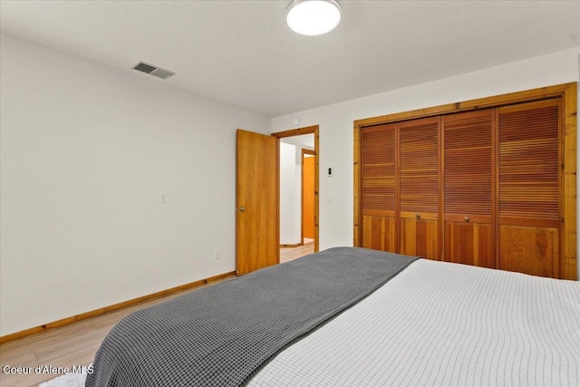 400 S Ohana Beach Dr, Coeur Dalene, ID 83814 - bedroom featuring a closet and light wood finished floors