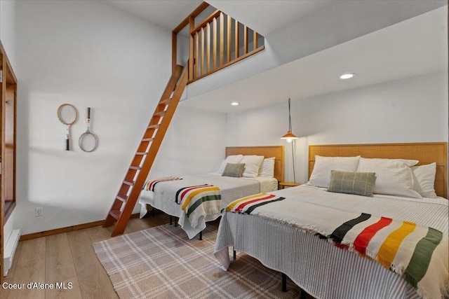 400 S Ohana Beach Dr, Coeur Dalene, ID 83814 - bedroom with wood finished floors and recessed lighting