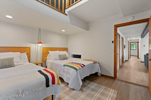400 S Ohana Beach Dr, Coeur Dalene, ID 83814 - bedroom with wood finished floors and recessed lighting