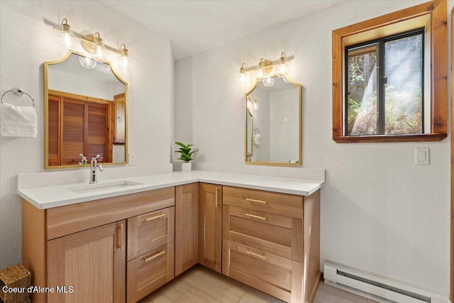 400 S Ohana Beach Dr, Coeur Dalene, ID 83814 - bathroom featuring a baseboard radiator, vanity, and tile patterned floors