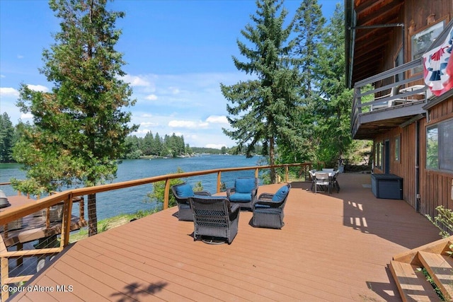 400 S Ohana Beach Dr, Coeur Dalene, ID 83814 - wooden terrace featuring outdoor dining area and a water view