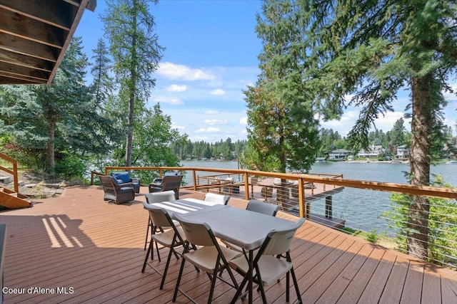 400 S Ohana Beach Dr, Coeur Dalene, ID 83814 - wooden terrace with a water view and outdoor dining area
