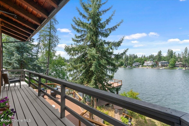 400 S Ohana Beach Dr, Coeur Dalene, ID 83814 - deck featuring a water view and view of scattered trees