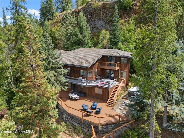 400 S Ohana Beach Dr, Coeur Dalene, ID 83814 - rear view of house with a wooden deck, a view of trees, stairs, and a balcony