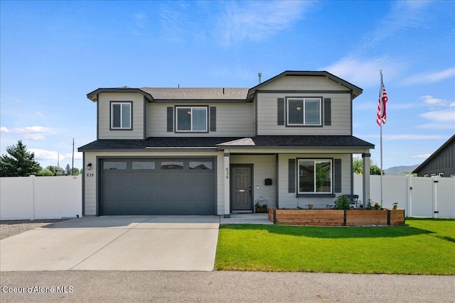 838 W Jenicek Loop, Post Falls, ID 83854 - traditional-style home featuring an attached garage, driveway, and a shingled roof