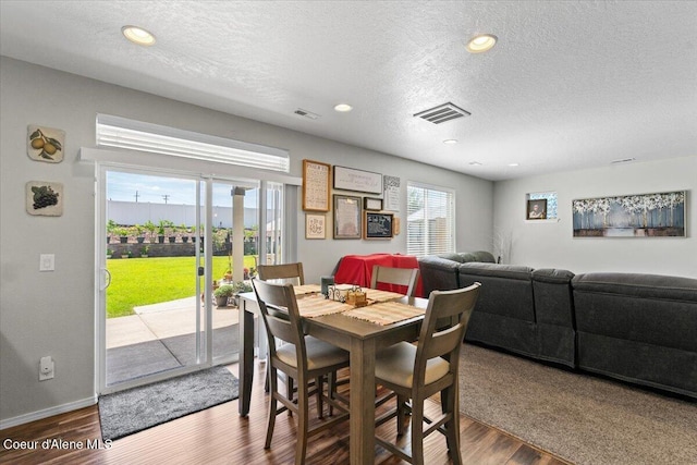 838 W Jenicek Loop, Post Falls, ID 83854 - dining area featuring a textured ceiling, wood finished floors, and recessed lighting