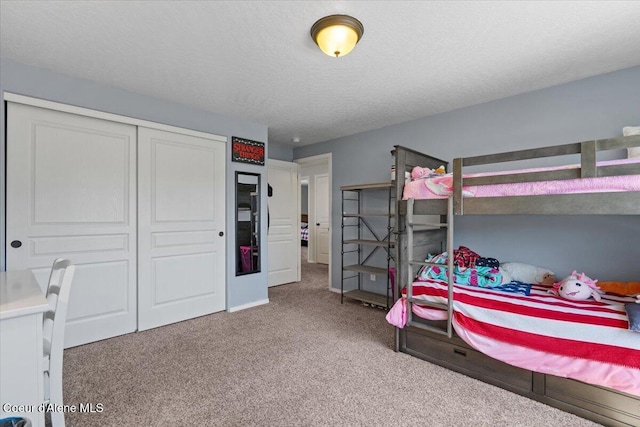838 W Jenicek Loop, Post Falls, ID 83854 - carpeted bedroom featuring a closet and a textured ceiling
