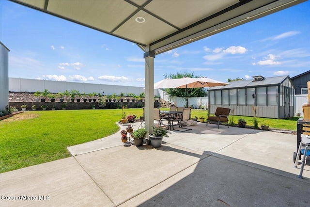 838 W Jenicek Loop, Post Falls, ID 83854 - fenced backyard featuring an exterior structure, a patio, an outdoor structure, and outdoor dining area