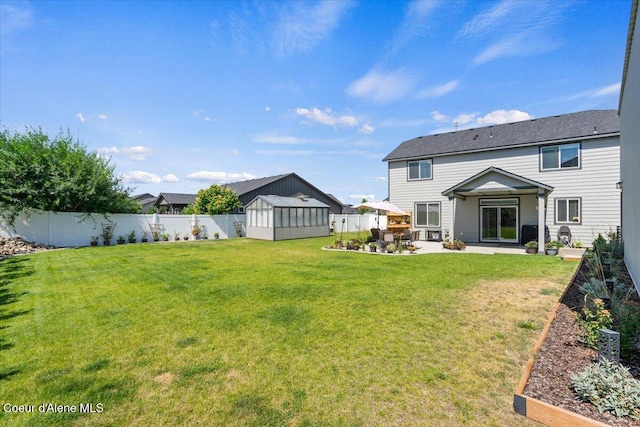 838 W Jenicek Loop, Post Falls, ID 83854 - fenced backyard with a storage shed, a patio, and a garden