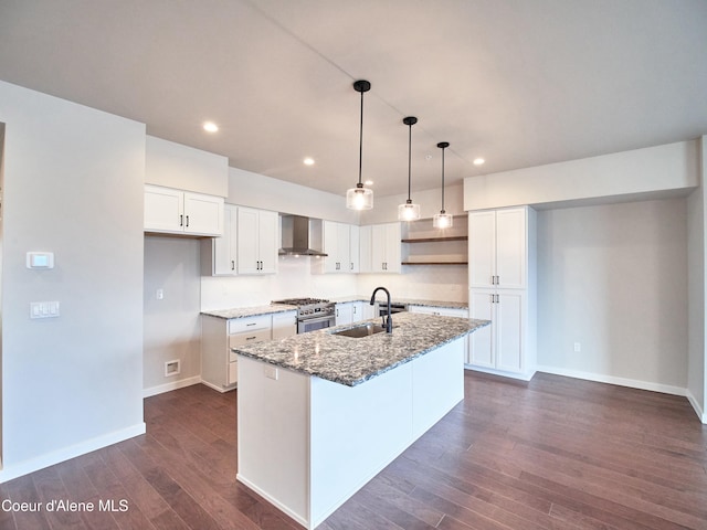 953 E Railroad Ave, Post Falls, ID 83854 - kitchen featuring wall chimney range hood, stainless steel range, stone counters, white cabinets, and recessed lighting
