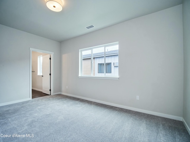 953 E Railroad Ave, Post Falls, ID 83854 - unfurnished room featuring dark colored carpet and baseboards