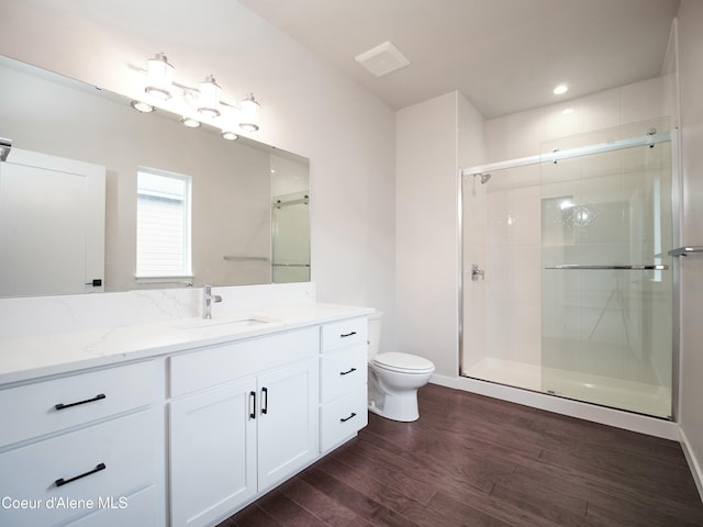 953 E Railroad Ave, Post Falls, ID 83854 - full bathroom with wood finished floors, a shower stall, vanity, and recessed lighting
