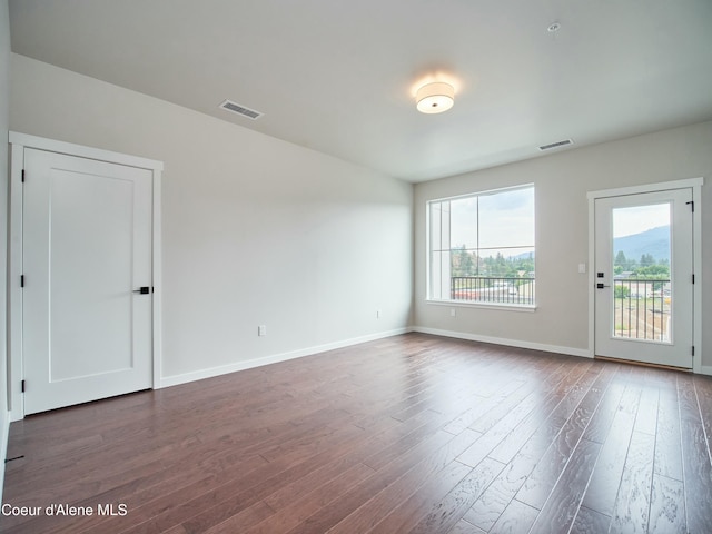 953 E Railroad Ave, Post Falls, ID 83854 - unfurnished room featuring dark wood-style flooring and baseboards