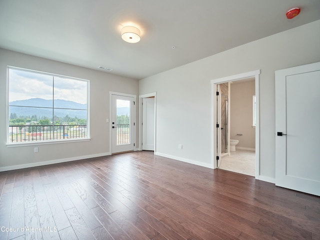 953 E Railroad Ave, Post Falls, ID 83854 - spare room featuring a mountain view and dark wood-style floors