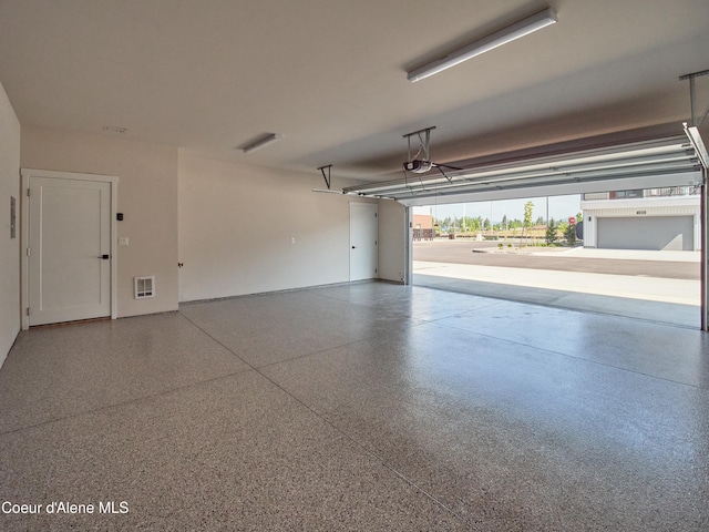 953 E Railroad Ave, Post Falls, ID 83854 - garage with a garage door opener and baseboards
