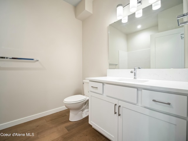 993 E Railroad Ave, Post Falls, ID 83854 - bathroom featuring wood finished floors and vanity
