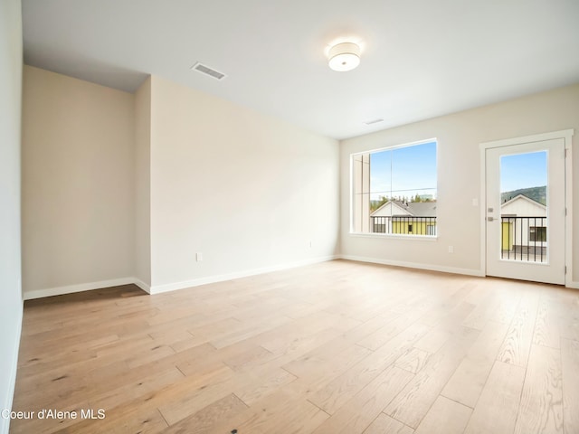 993 E Railroad Ave, Post Falls, ID 83854 - empty room with light wood-style flooring and baseboards