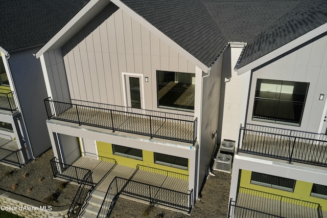 993 E Railroad Ave, Post Falls, ID 83854 - view of home's exterior with a balcony and a shingled roof