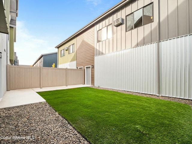 993 E Railroad Ave, Post Falls, ID 83854 - view of yard with a wall unit AC and a patio area