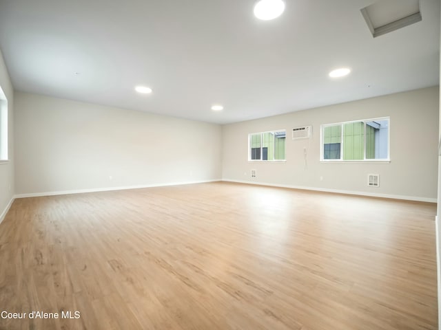 993 E Railroad Ave, Post Falls, ID 83854 - spare room with light wood-type flooring, recessed lighting, and an AC wall unit