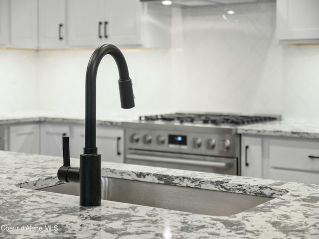 995 E Railroad Ave, Post Falls, ID 83854 - kitchen view of white cabinetry and light stone countertops
