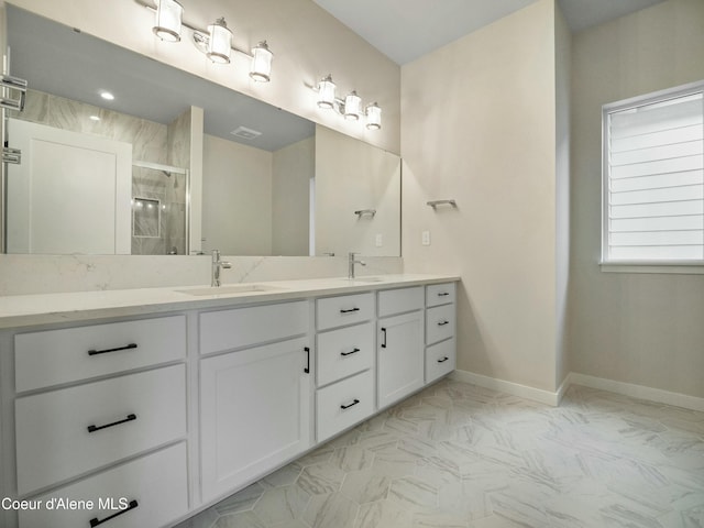995 E Railroad Ave, Post Falls, ID 83854 - bathroom featuring double vanity, a stall shower, and marble finish floors