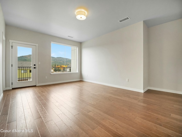 995 E Railroad Ave, Post Falls, ID 83854 - unfurnished room featuring wood finished floors and baseboards