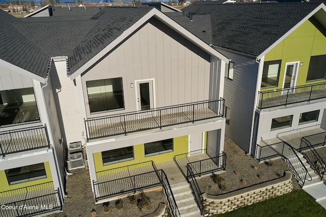 995 E Railroad Ave, Post Falls, ID 83854 - rear view of property featuring a balcony and a shingled roof