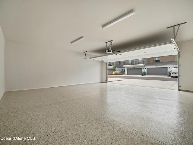 995 E Railroad Ave, Post Falls, ID 83854 - garage with a garage door opener and baseboards