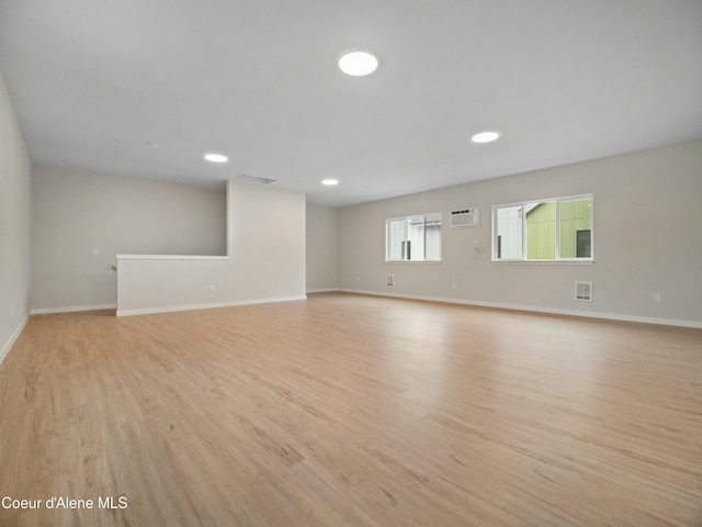 995 E Railroad Ave, Post Falls, ID 83854 - spare room with light wood-type flooring, a wall mounted AC, and recessed lighting