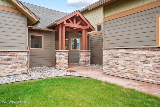 24 Bellflower, Blanchard, ID 83804 - view of exterior entry featuring stone siding and roof with shingles