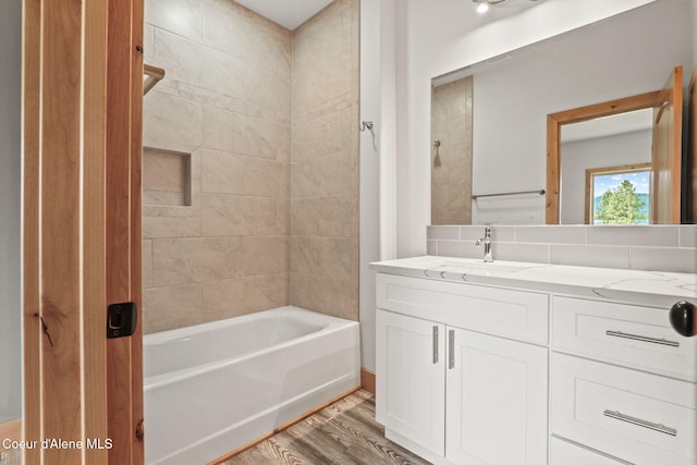 24 Bellflower, Blanchard, ID 83804 - bathroom featuring vanity, wood finished floors, and bathing tub / shower combination