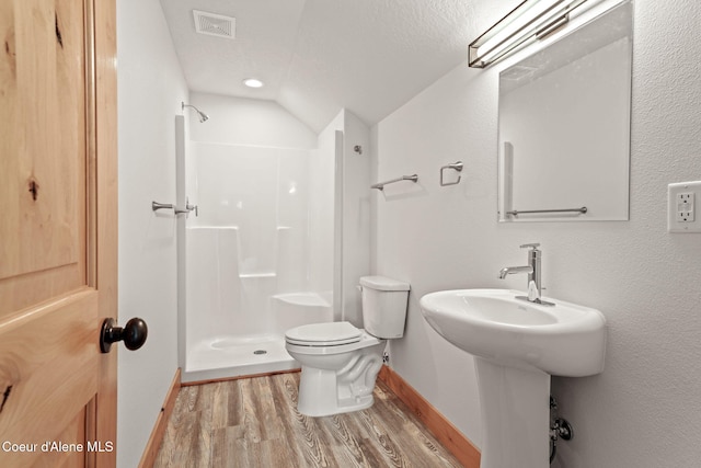 24 Bellflower, Blanchard, ID 83804 - full bath with a walk in shower, wood finished floors, and lofted ceiling