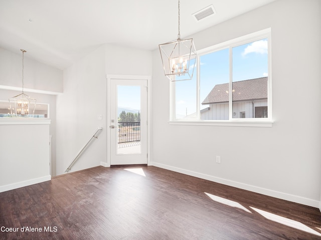962 E Railroad Ave, Post Falls, ID 83854 - unfurnished dining area with a chandelier and wood finished floors