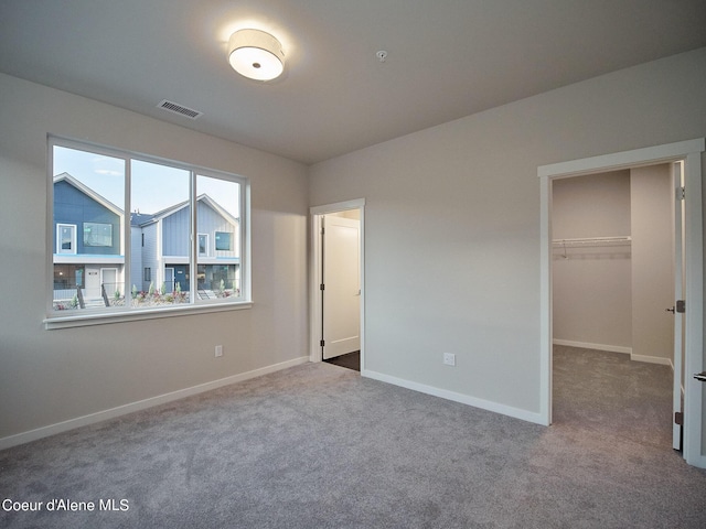 962 E Railroad Ave, Post Falls, ID 83854 - unfurnished bedroom with carpet floors and a walk in closet