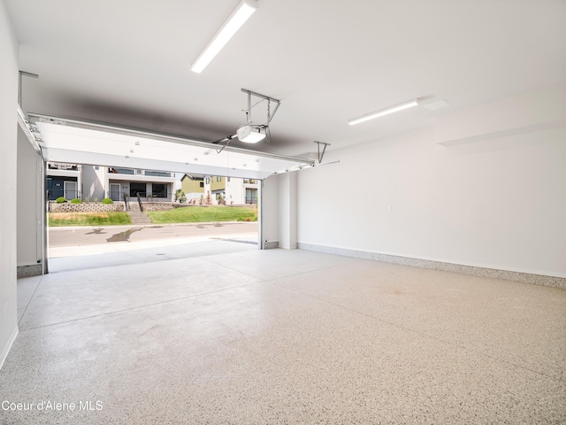 962 E Railroad Ave, Post Falls, ID 83854 - garage featuring baseboards and a garage door opener