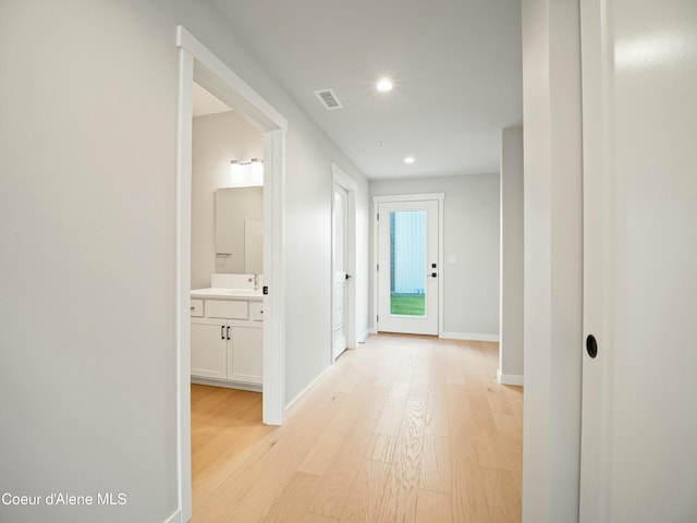 1033 E Railroad Ave, Post Falls, ID 83854 - hallway with light wood-style flooring and recessed lighting