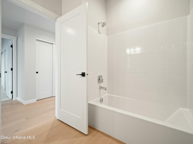 1033 E Railroad Ave, Post Falls, ID 83854 - bathroom featuring shower / bath combination and wood finished floors