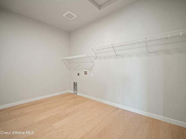 1033 E Railroad Ave, Post Falls, ID 83854 - laundry room with light wood-style floors, electric dryer hookup, and washer hookup