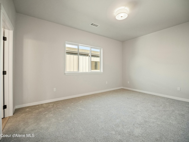 1033 E Railroad Ave, Post Falls, ID 83854 - carpeted empty room featuring baseboards