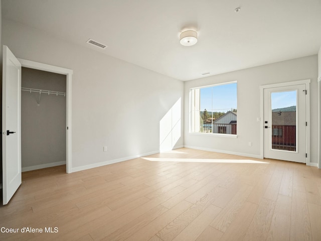1033 E Railroad Ave, Post Falls, ID 83854 - unfurnished living room featuring light wood-type flooring