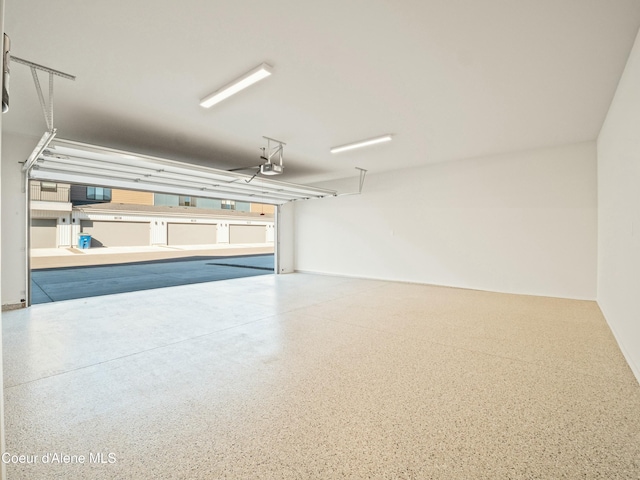 1033 E Railroad Ave, Post Falls, ID 83854 - garage featuring a garage door opener