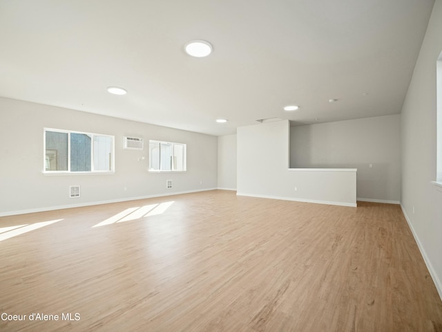 1033 E Railroad Ave, Post Falls, ID 83854 - spare room featuring a wall mounted AC, light wood-style floors, and recessed lighting